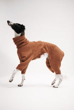 Load image into Gallery viewer, A silken windsprite is standing with its side towards the camera. She is in a photo studio with light grey background, and she's wearing a brown wool jumpsuit. The jumpsuit has a long neck which is scrunched down and covers a little more than half the neck, and the legs of the jumpsuit reach just above the hooks. You can spot a little drawstring at the waist.
