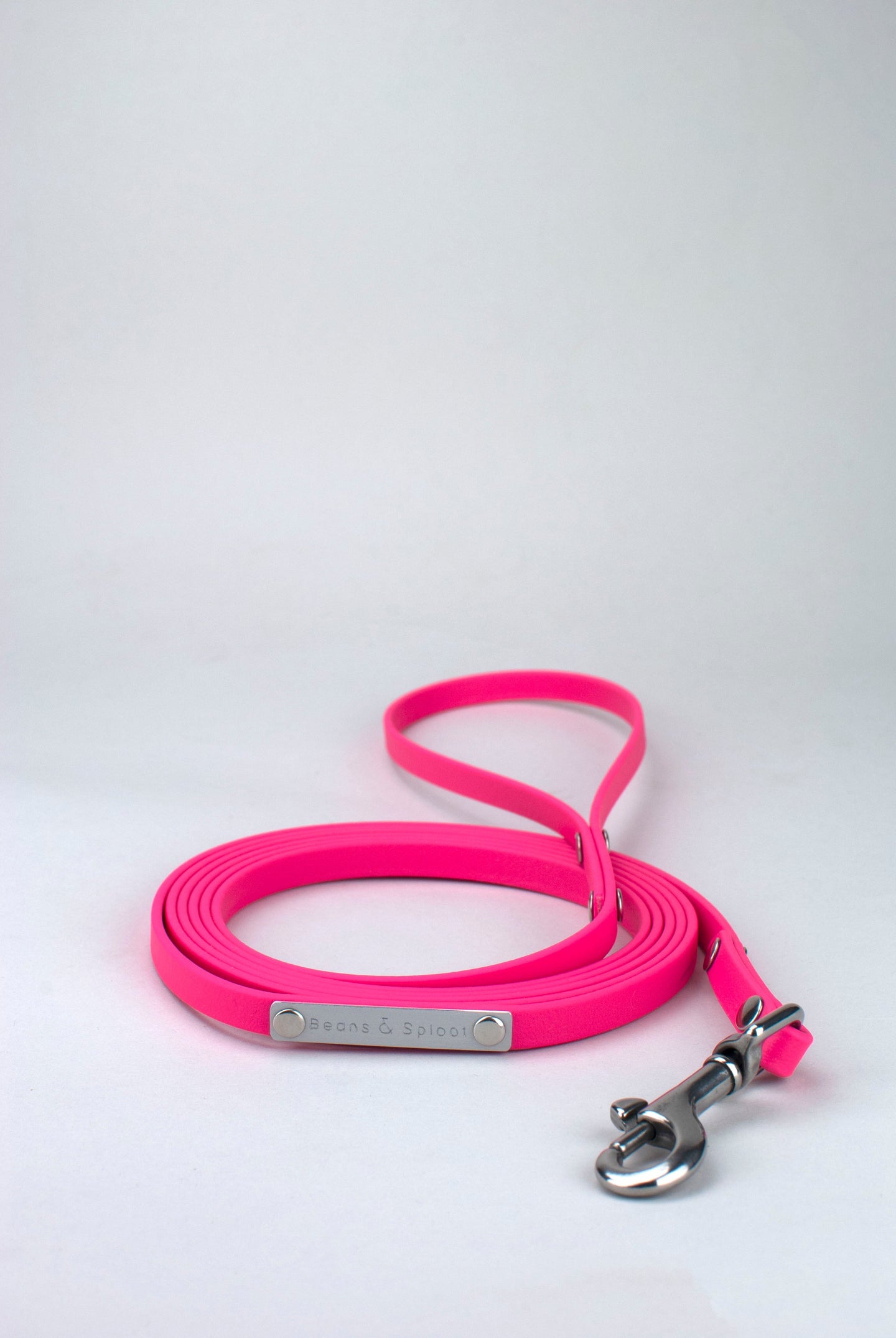 Bright pink lead in biothane with silver details.