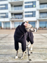 Load image into Gallery viewer, Front view of a whippet wearing a black wool onesie with a long neck that reaches all the way up to the dog&#39;s ears.
