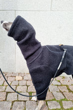 Load image into Gallery viewer, A whippet wearing a black wool onesie. The dog is facing the side and the front half of her body is showing. 
