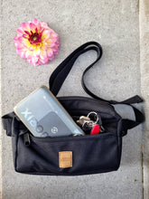 Load image into Gallery viewer, Black and square dog treat bag showing that a large phone and keys fit in the front pocket
