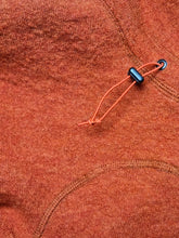 Load image into Gallery viewer, Close up of the flat seams of the wool onesie for dogs.

